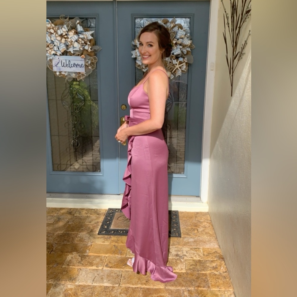 Celebrate brand formal high-low mauve colored dress with bow and ruffle accents